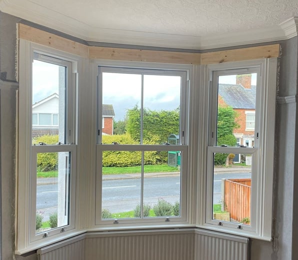 A bay window which is letting in lots of natural light.