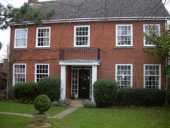 A house with vertical slider windows installed showing the benefits of them.