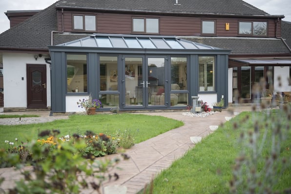 A house with an Ultraframe conservatory installed showing why you should use ultraframe.