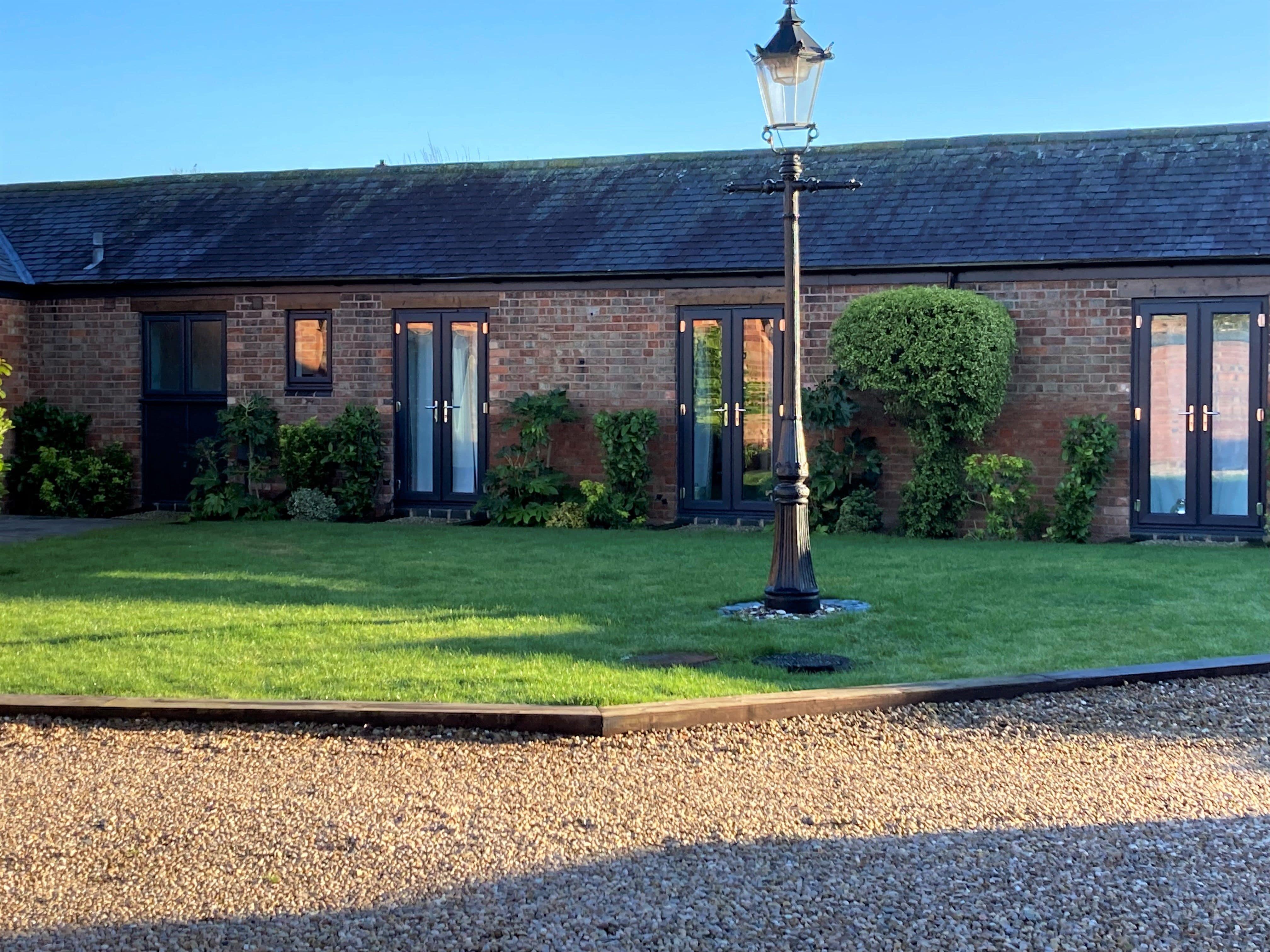  A new alitherm heritage door opened into a garden showing how special they are compared to other doors 