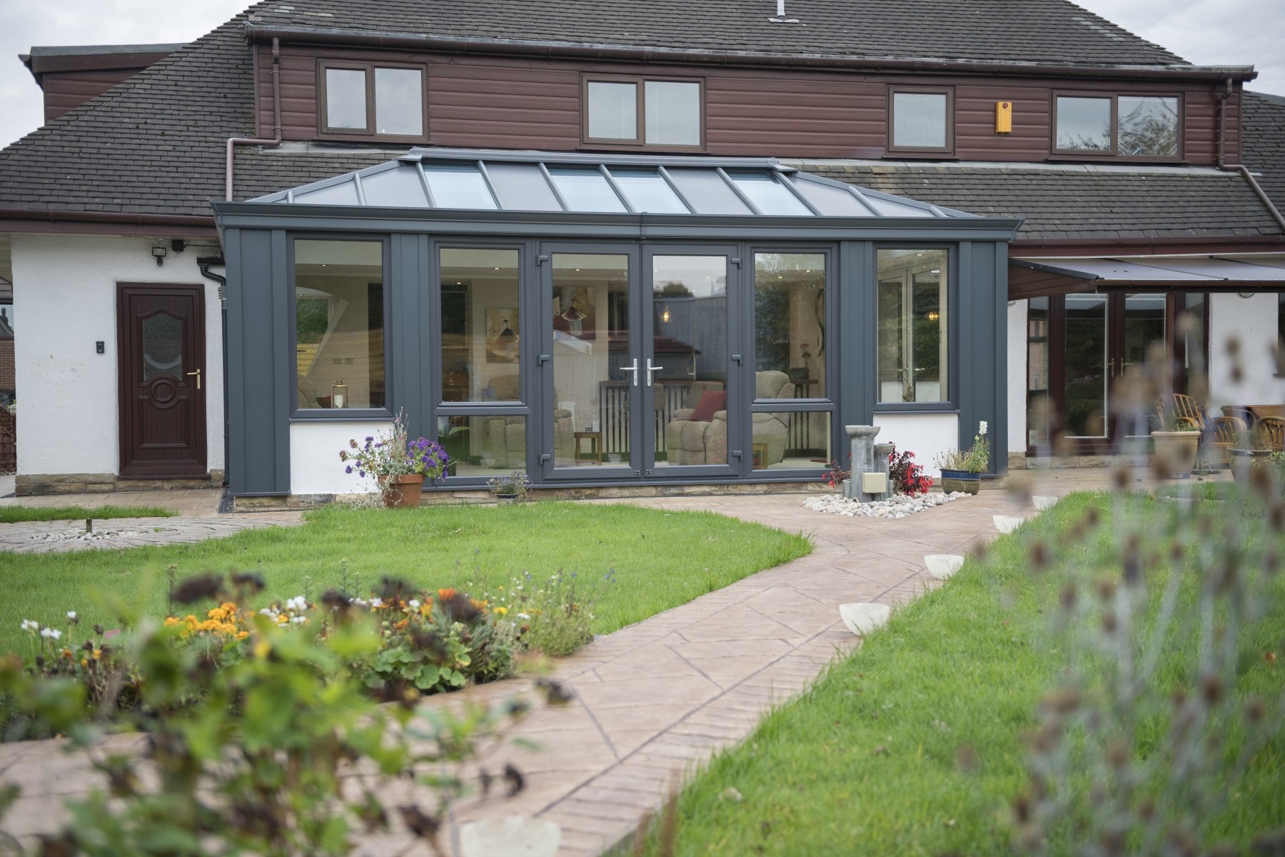 A house with an Ultraframe conservatory installed showing why you should use ultraframe. 